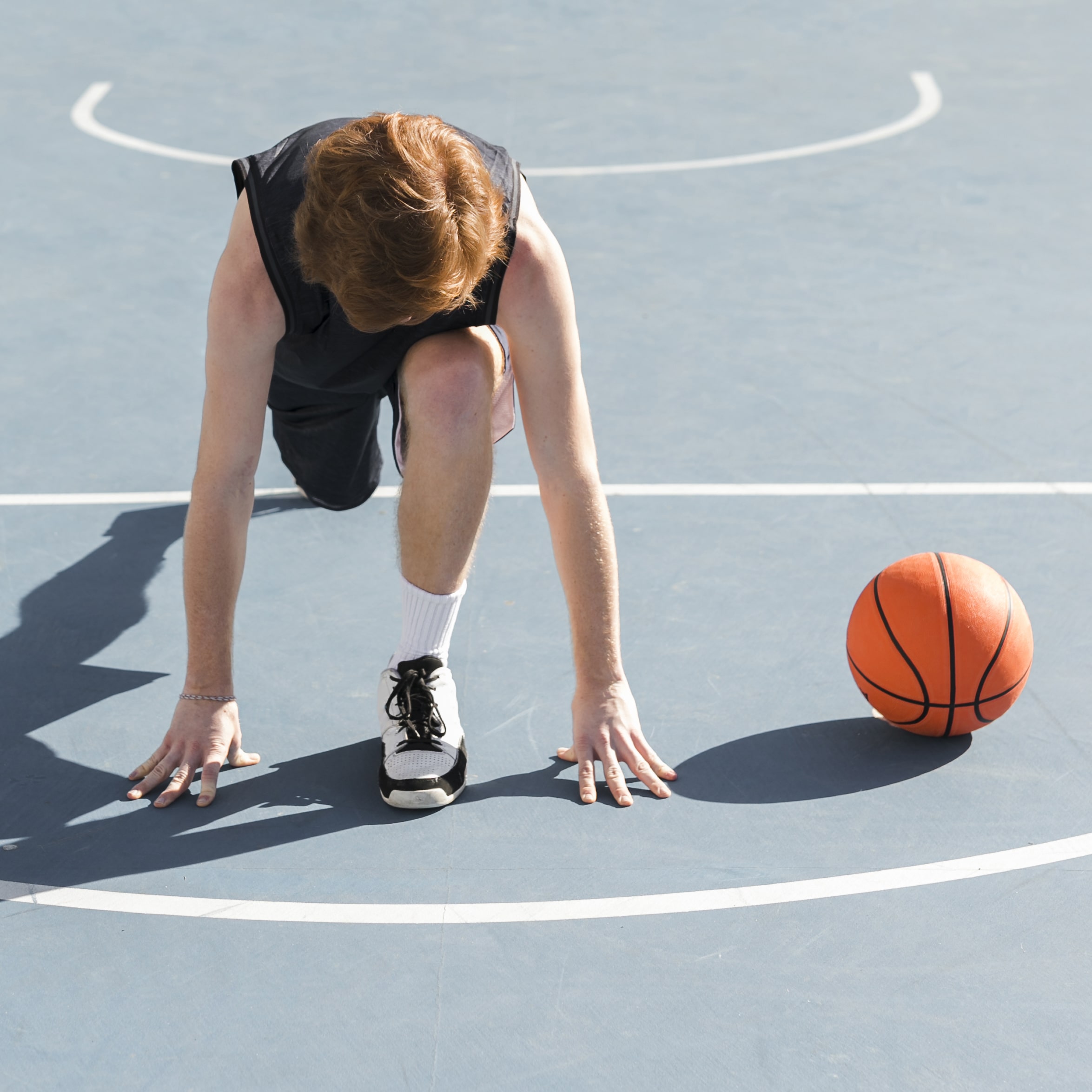long-shot-boy-with-basketball-ball-min